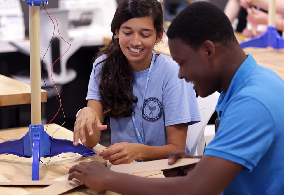 Students work to create their own wind turbines as part of the Energy Literacy, Engagement and Action Program. Photo by Lars Sahl.