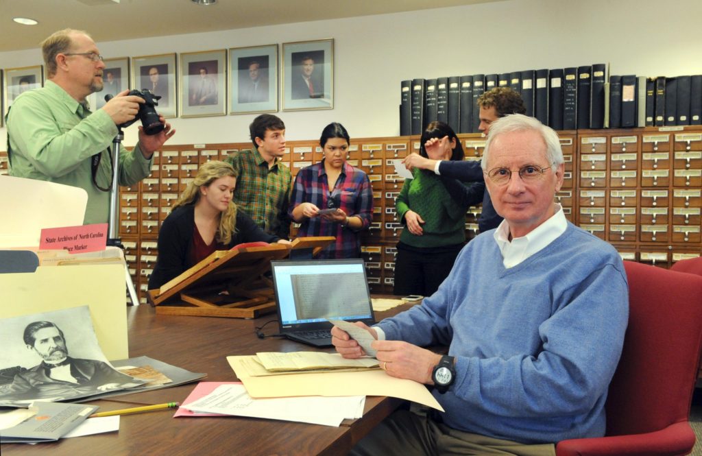 American studies professor Robert Allen and the Community Histories Workshop team visited the State Archives of North Carolina in Raleigh in December to explore materials related to Dorothea Dix Hospital. Their historical research will inform the master plan and programming of a future urban park on the site of the hospital, which closed its doors in 2012. (photo by Donn Young)