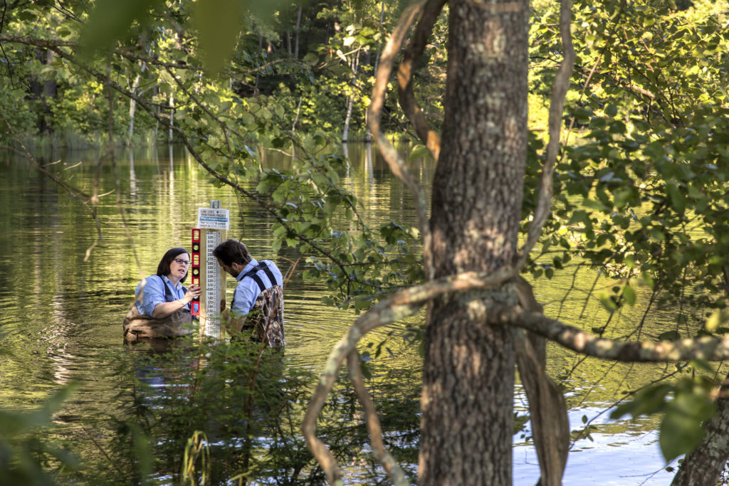 A University of North Carolian at Chapel Hill team led by geologist Tamlin Pavelsky has received funding from NASA’s Earth Science Division to expand a pilot citizen science program to measure lake water storage from North Carolina to the globe. (photo courtesy of the Institute for the Environment) Pavelsky is shown here with another researcher embedded in the lake measuring water quality.