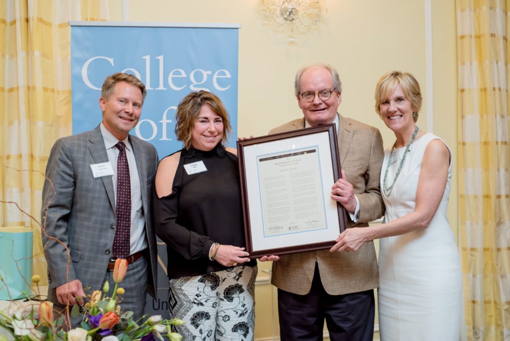 From left, Kevin Guskiewicz, Lanier May, Jamie May (holding the special proclamation in his honor) and Sunny Burrows. (photo courtesy of Fire Rose Photography NC).