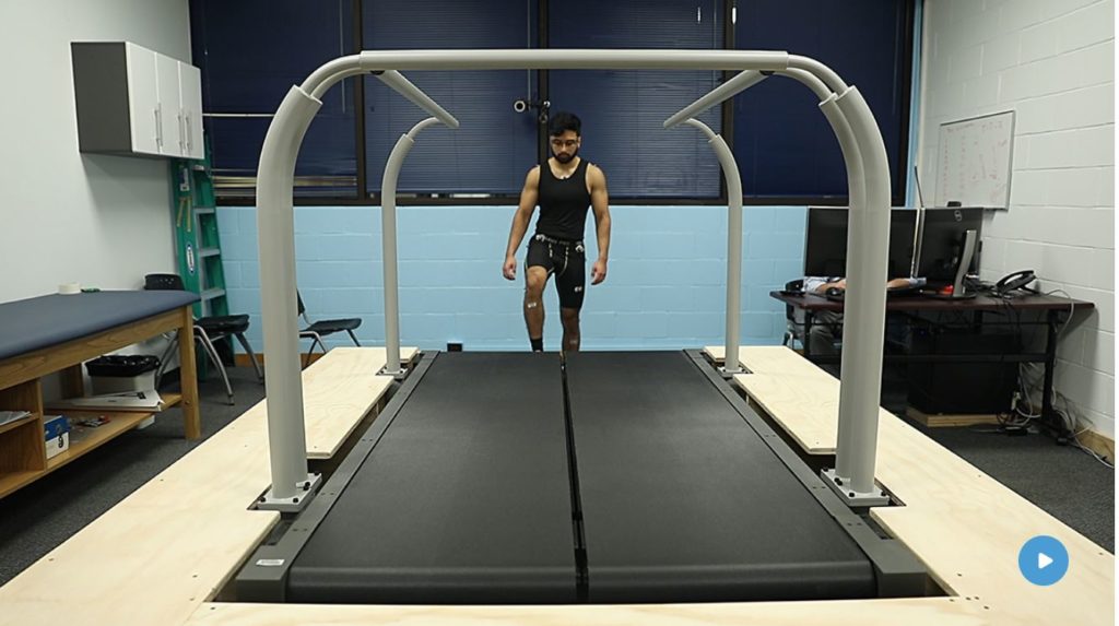 picture shows a man walking and jumping up and down on a machine as he's wearing tiny sensors