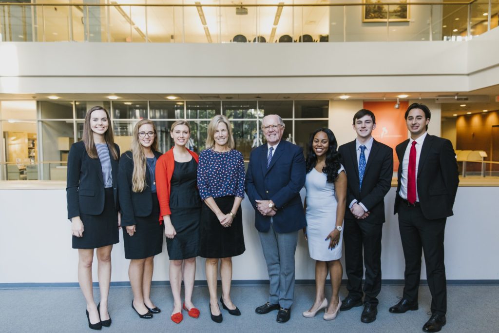 Students, staff and supporters gather to celebrate the Phillips Ambassadors at a dinner on Nov. 7. Pictured (from left to right): Anna Martinez, Katie Ayscue, Parrish Finn, Kim Phillips, Phil Phillips, Taylor Doggett, Gardner Davis, Alfredo Lopez-Sotillo, (photo by Jeyhoun Allebaugh/UNC-Chapel Hill).