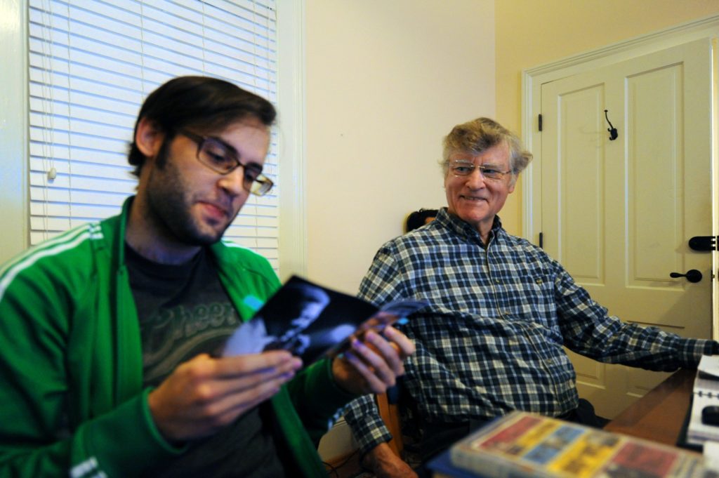 Bill Ferris (right) talks with a student in his Southern Music class. (photo by Donn Young)