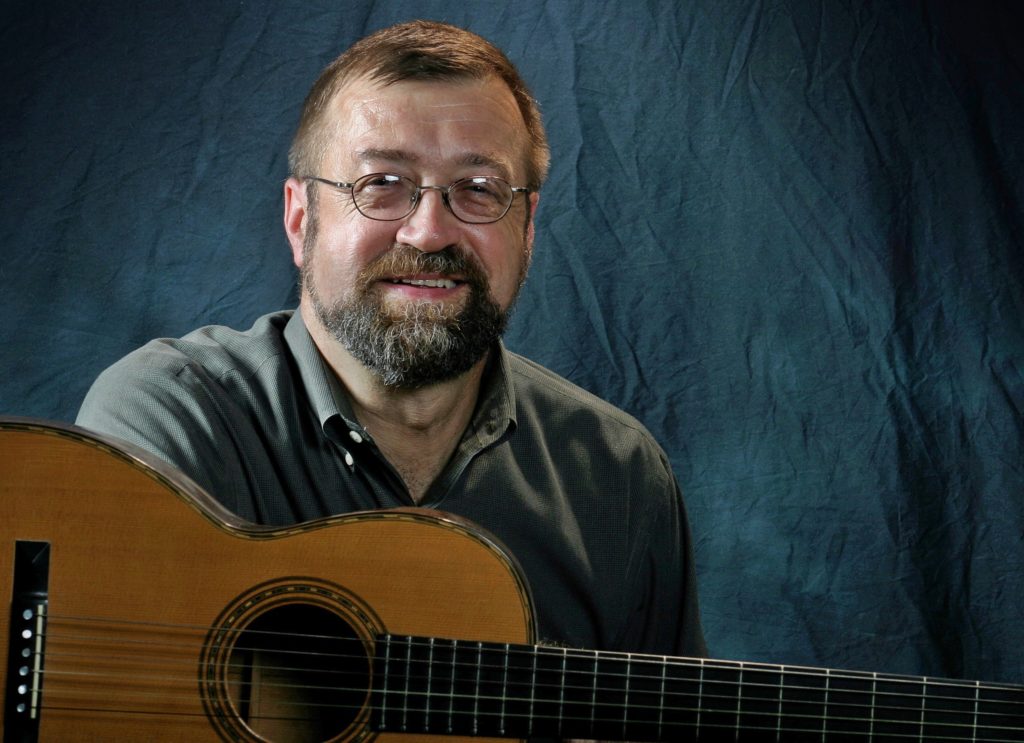 Philip Gura received the Order of the Long Leaf Pine. He is pictured here with a guitar.