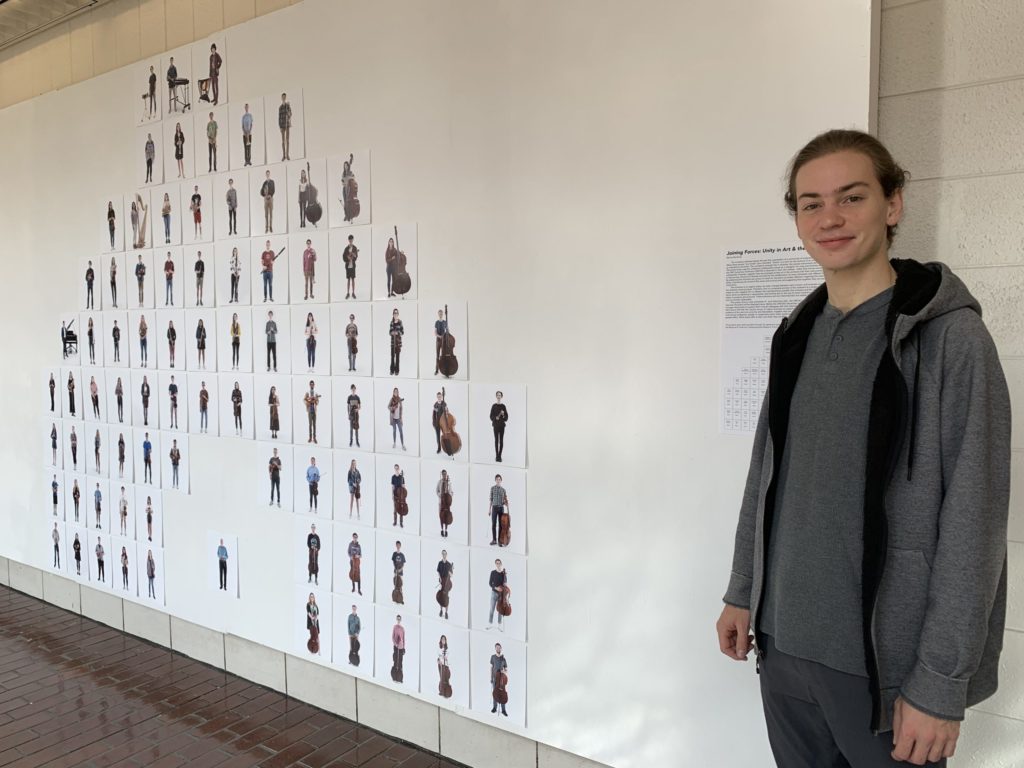 Barron Northrup with his exhibit in Hanes Art Center. (photo by Crystal Wu)