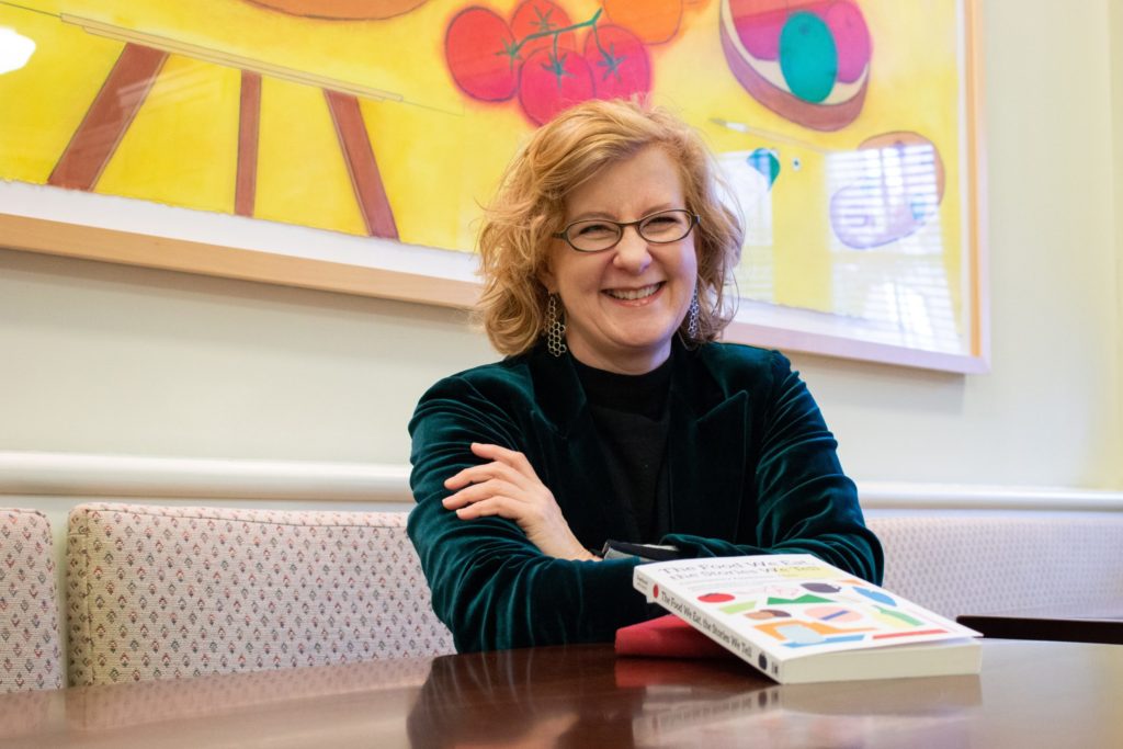 Elizabeth Engelhardt in the Hyde Hall kitchen with her book, "The Food We Eat, the Stories We Tell: Contemporary Appalachian Tables." (photo by Kristen Chavez)