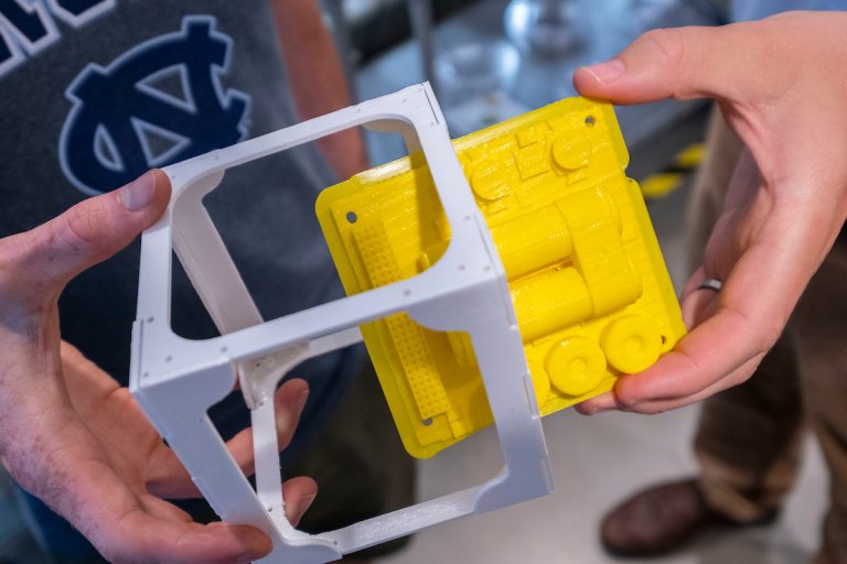 Closeup of a CubeSat being built in the makerspace. (photo by Jon Gardiner)