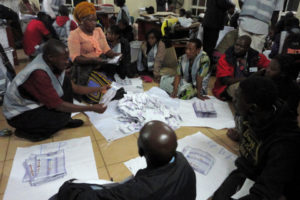 Ballots being counted in the 2014 Malawian presidential and parliamentary elections.