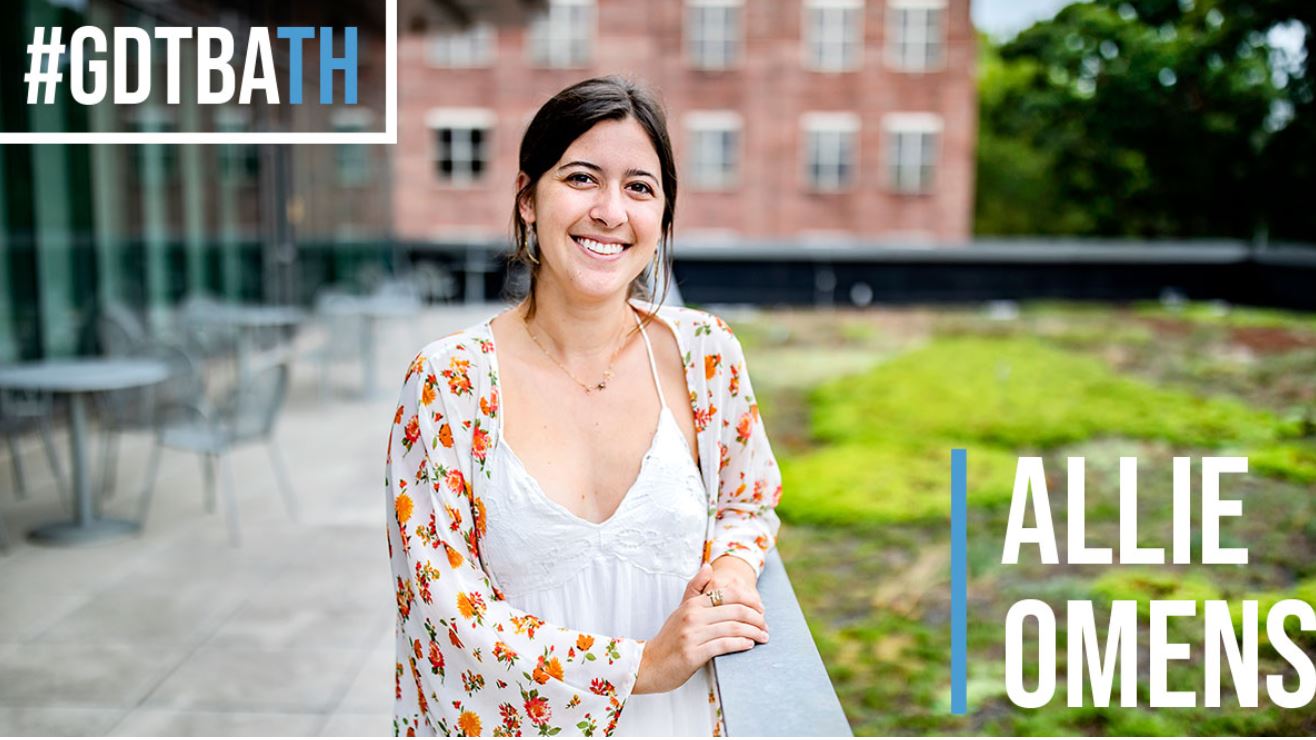 Senior Allie Omens is pictured outside on campus with the words "Allie Omens" and "GDTBATH" on the photo