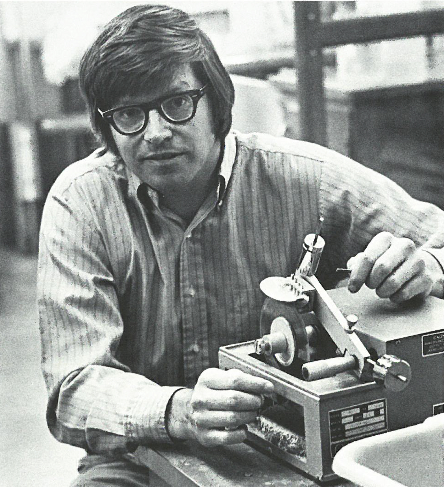 Continuing his work on clam aging, Peterson uses a tool to cut a shell in half. In this 1982 project, he determined the average age of clams in Core Sound to be 9 years old. Ages among clams in the sample ranged from less than one year to 32. I photo by Kathy Hart, Coastwatch magazine