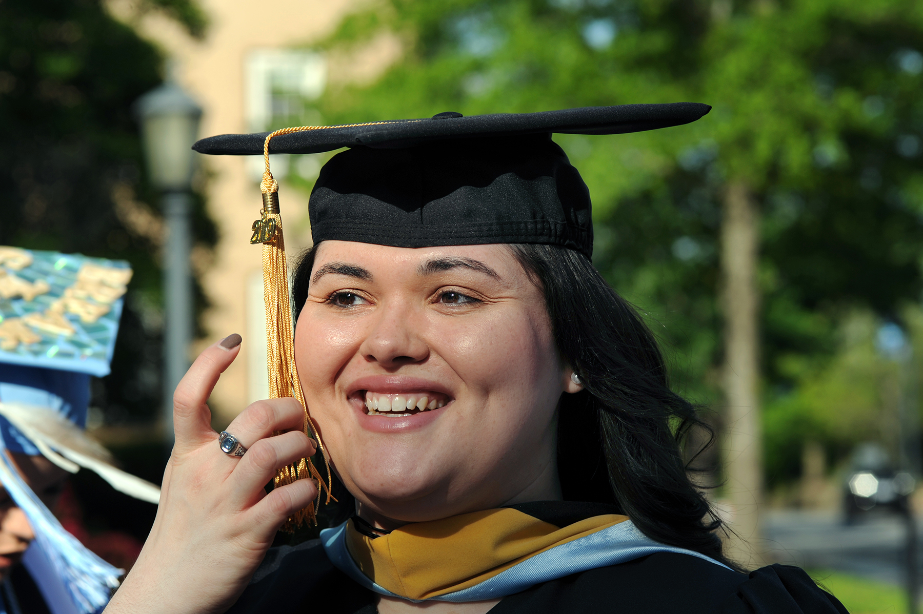 Victoria Chavis will graduate with a master's in social work and enter NC State's PhD program in the fall in higher education administration. (photo by Donn Young) Closeup of Victoria in her cap and gown