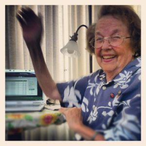 Helen Hunter sits next to a computer she used to complete her last college course.