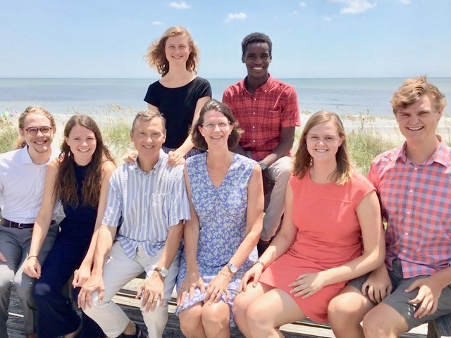 The King family members group photo at the beach.