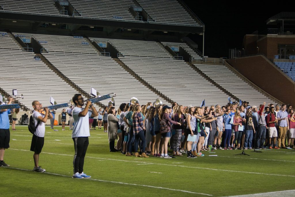 The Marching Tar Heels rehearsing the Notre Dame halftime show with singers from vocal ensembles including the Carolina Choir. Photo by Alessandro Uribe-Rheinbolt.