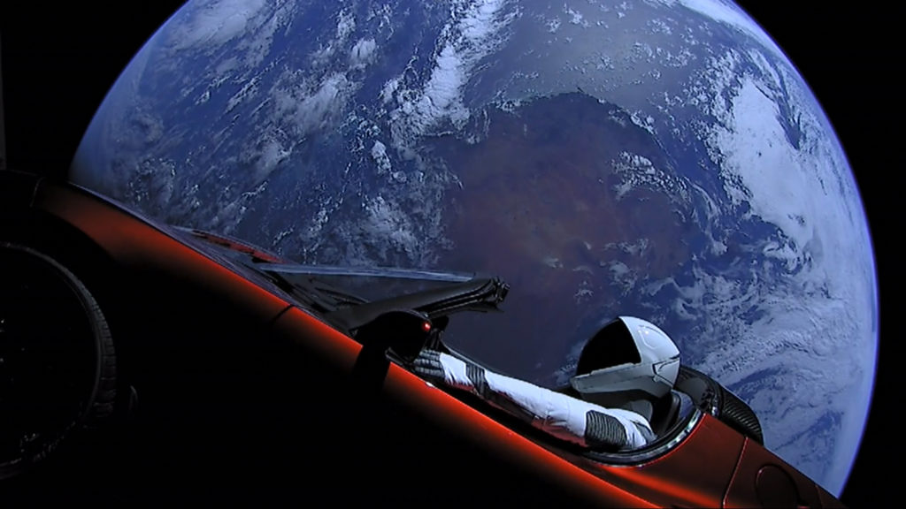 Photo of Star Man in the Tesla in space with Earth in background