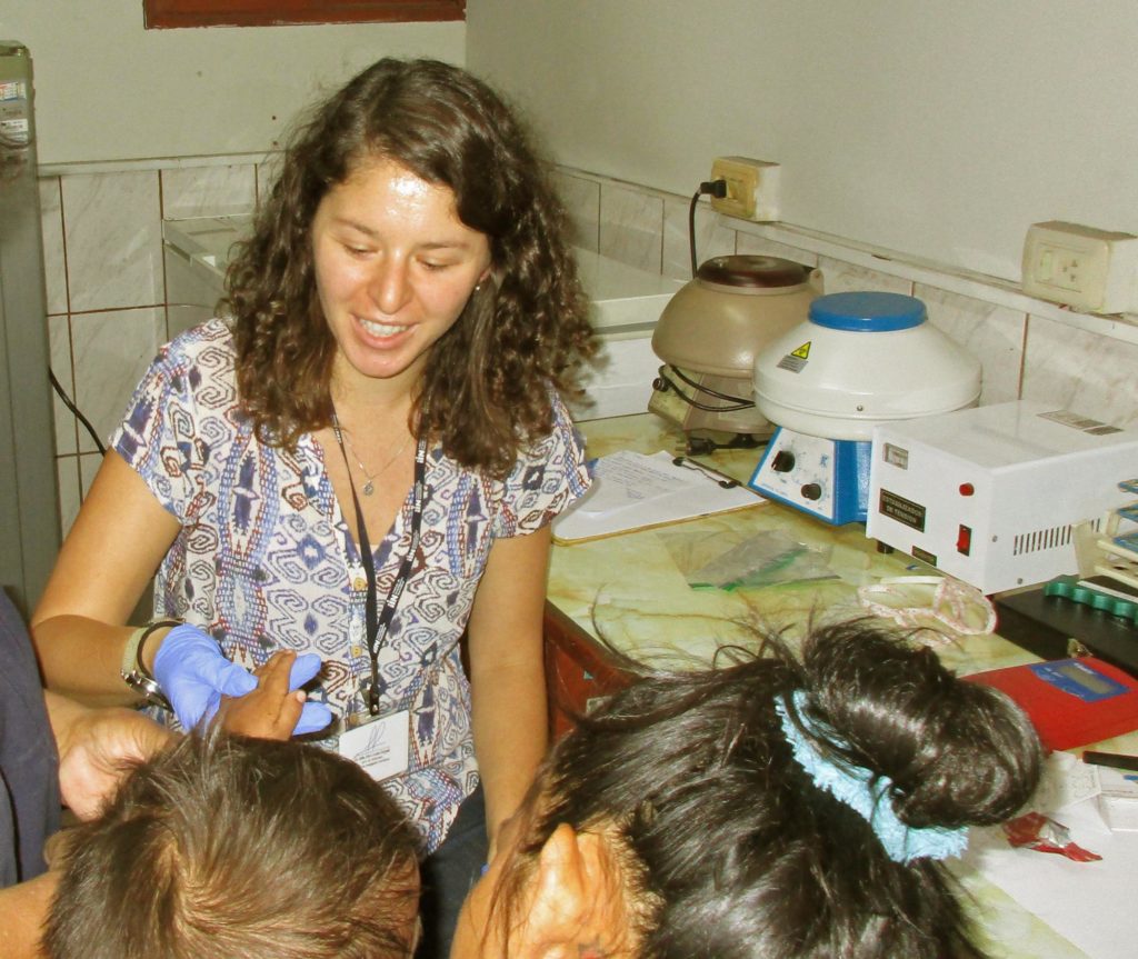 Anthropology Ph.D. student Achsah Dorsey is shown working with patients.