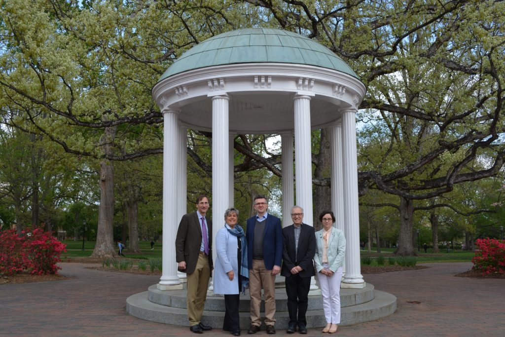 A delegation from King's College London recently visited UNC-Chapel Hill. The guests are standing in front of the Old Well.