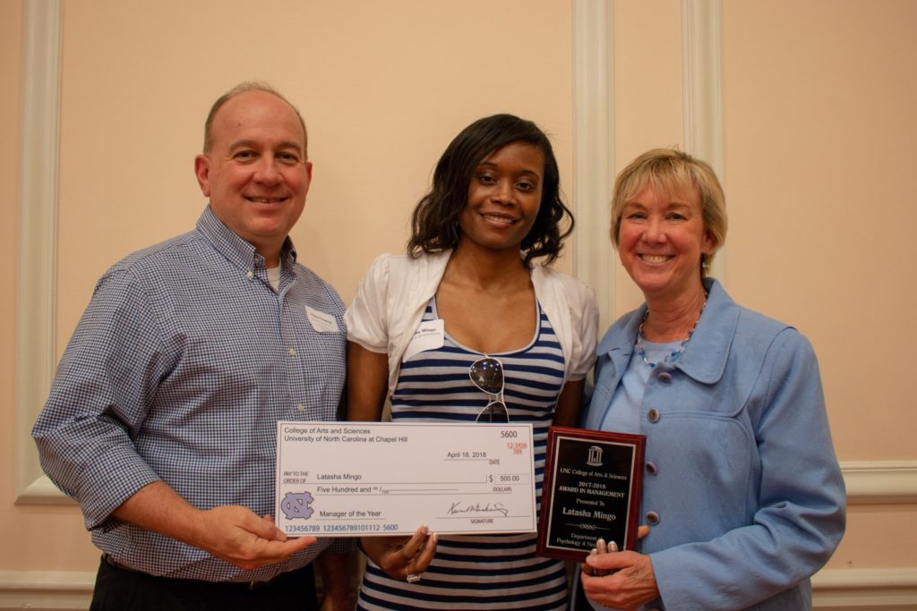 Latasha Mingo (middle) with Chris Clemens, senior associate dean for natural sciences; and Karen Gil, former dean of the College of Arts & Sciences and Pederson Distinguished Professor in the department of psychology and neuroscience. (photo by Kristen Chavez) Mingo is holding her check and award.