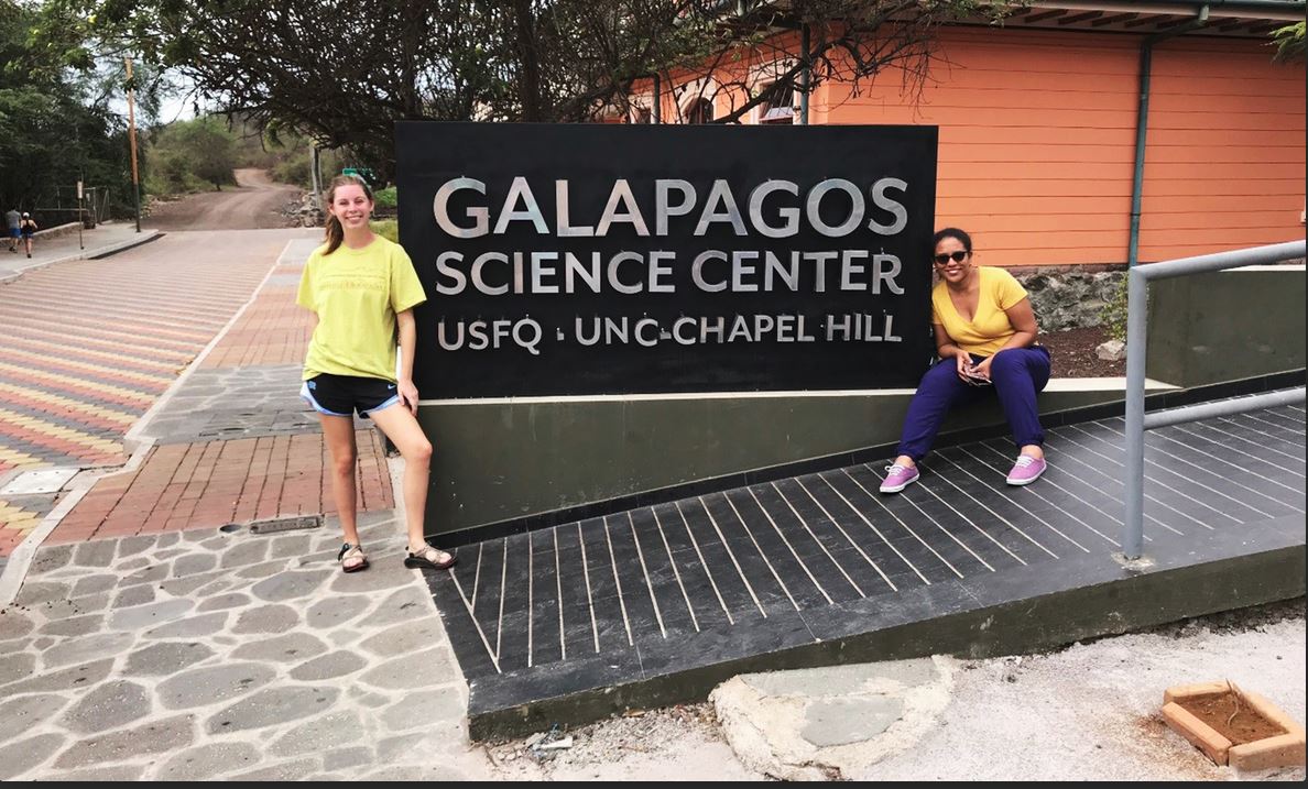Moser (left) and Gómez pose in front of the Galápagos Science Center, a joint effort between UNC and the Universidad San Francisco de Quito in Ecuador. (photo courtesy of Haley Moser)