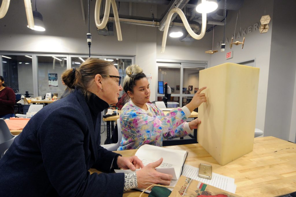 Susan Harbage Page, assistant professor of women's and gender studies, works with students in the campus makerspace in Murray Hall. (photo by Donn Young)