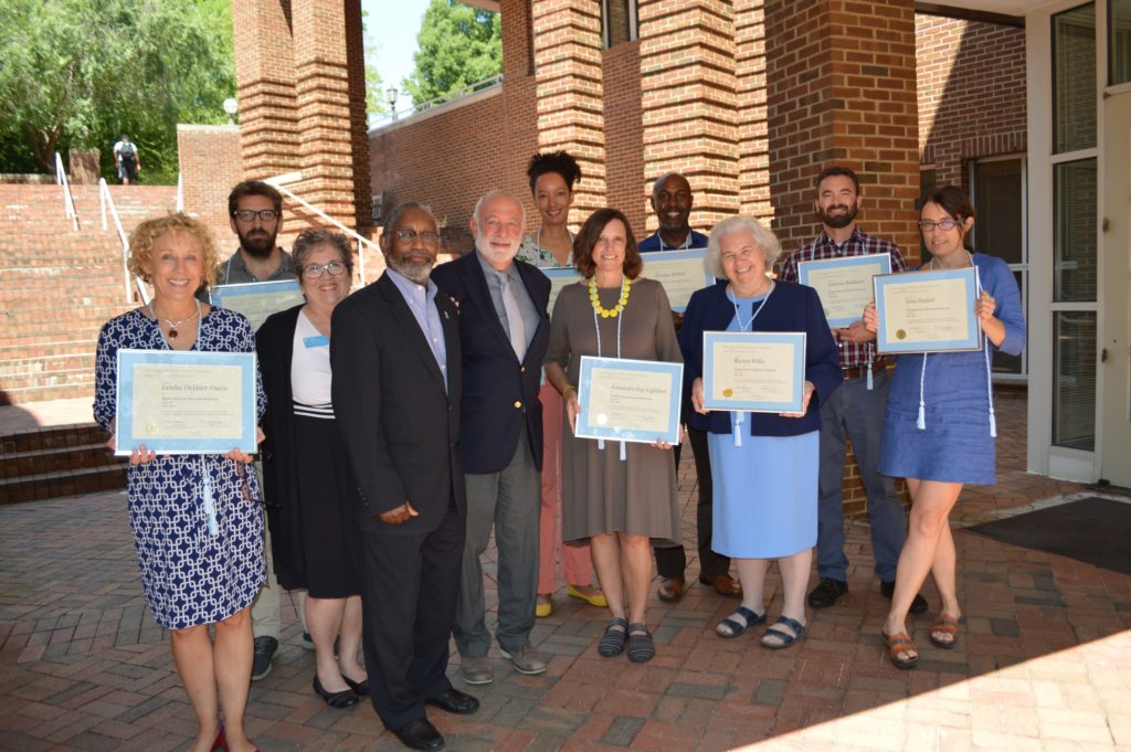 The new class of Thorp Faculty Engaged Scholars (group shot, standing outside George Wattt Hill Alumni Center)
