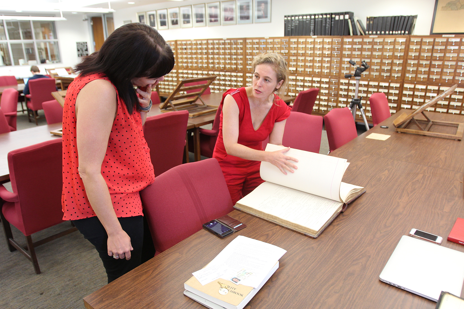From left, Sarah Almond and Tift Merritt working in the State Archive Reading Room. (photo by Will Bosley)
