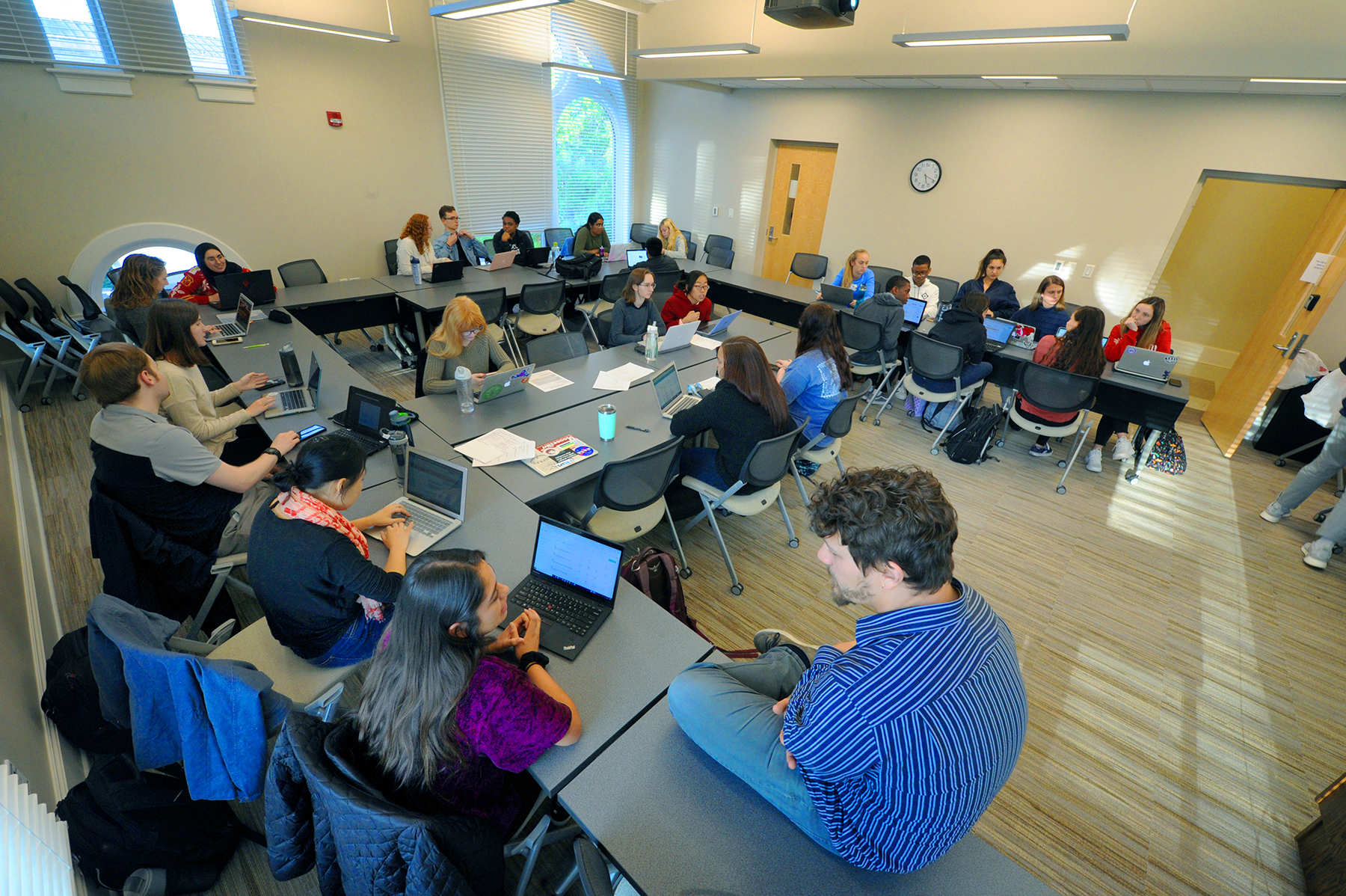 HGAPS members meet weekly over pizza in Howell Hall to brainstorm ideas and work on projects. (photo by Donn Young)