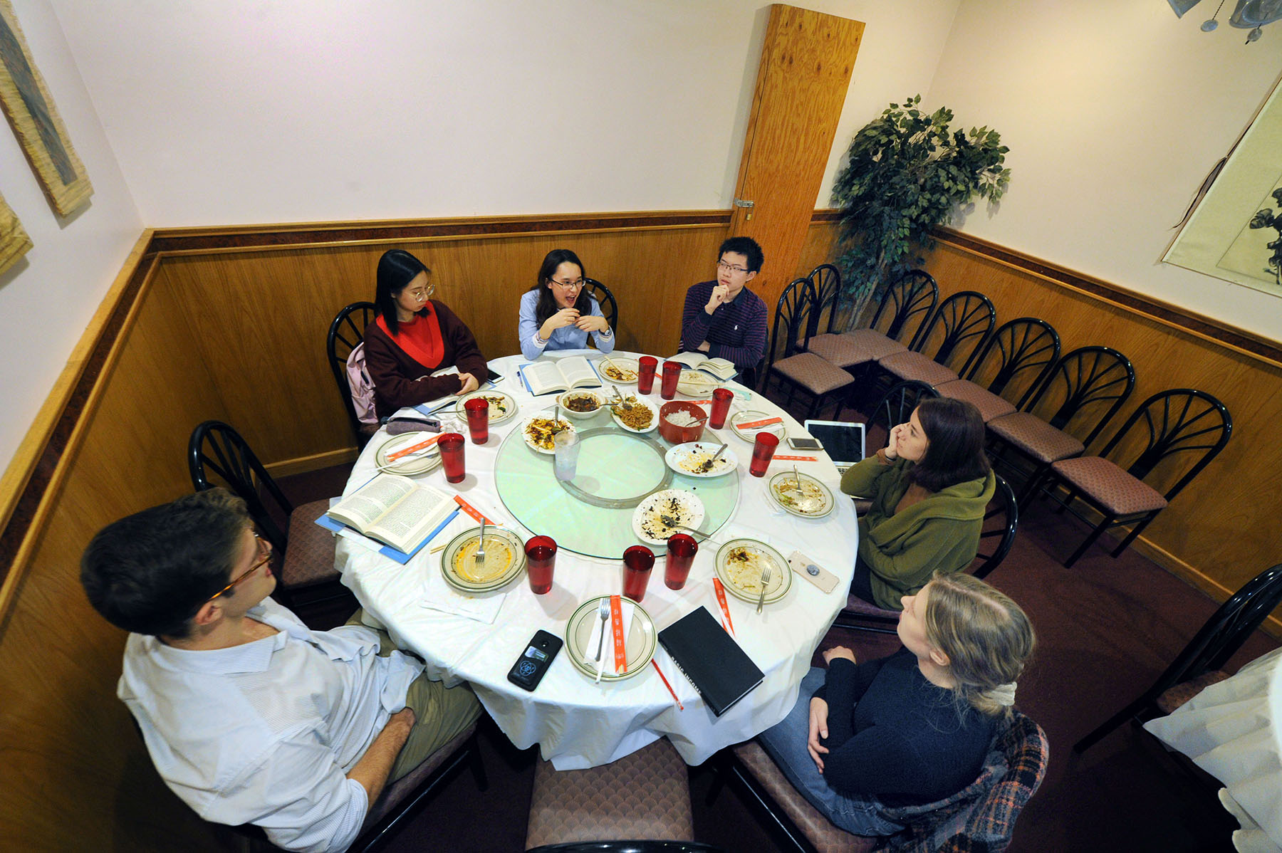 Student reading groups are a popular extracurricular component of the Philosophy, Politics and Economics Program. Here, students meet at a local restaurant to discuss their latest selection over Chinese food. (photo by Donn Young)