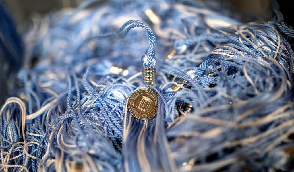 Detail photo of graduation tassels are on display during the "conGRADulations Fair for Graduating Students" on March 22, 2018, in Chapel Hill. The event was held so that students could pick out their caps, gowns, class rings and other graduation announcement material along with taking selfies with Rameses. (Johnny Andrews / UNC-Chapel Hill)