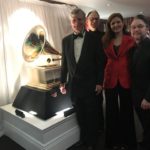 Bill and Dust-to-Digital collaborators stand in front of large Grammy statue.