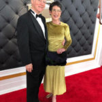 Bill and Marcie Ferris standing on the red carpet at the Grammys.
