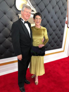 Bill and Marcie Ferris standing on the red carpet at the Grammys.