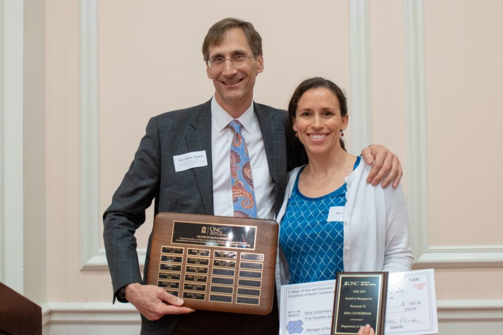 Sara Cockerham (right) accepts her award from Rudi Colloredo-Mansfeld, senior associate dean for social sciences and global programs. (photo by Kristen Chavez)