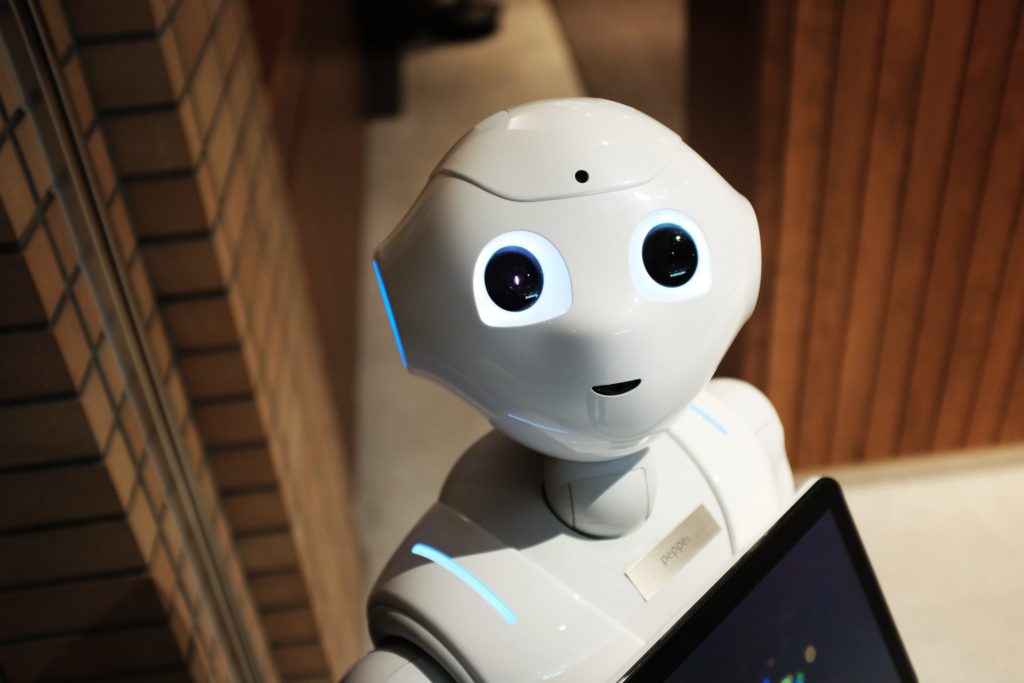 A new article by UNC researchers in Trends in Cognitive Sciences explores how the human moral mind is likely to make sense of robot responsibility. (photoof a robot staring at the camera by Alex Knight via Unsplash)