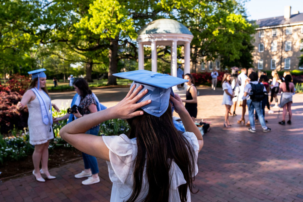 Students have their photos taken near the Old Well before the 2019 Spring Commencement on the campus of the University of North Carolina at Chapel Hill. (Jon Gardiner/UNC-Chapel Hill)