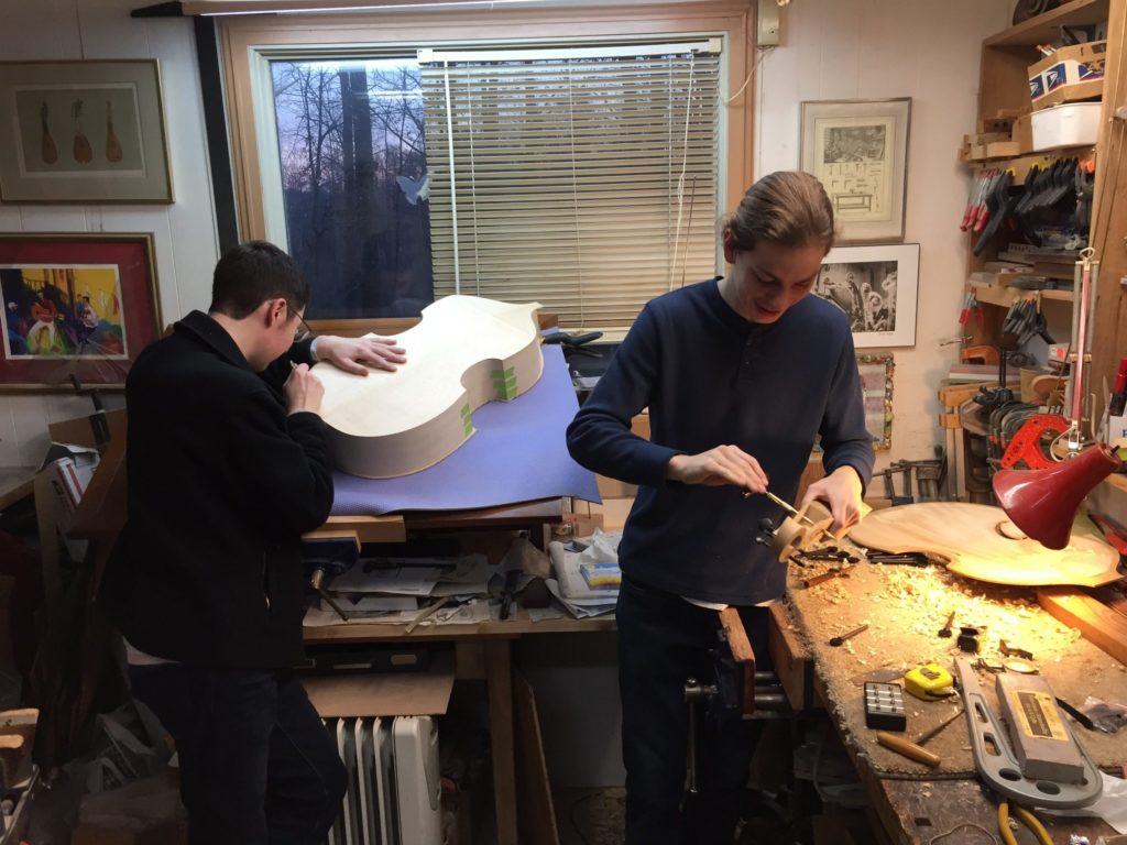 orbin Bryan, left, and Barron Northrup, right, working in John Pringle’s studio on the octochordon. (Photo credit John Pringle)