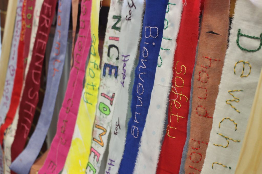 Messages of welcome embroidered by members of the Royal Opera House Thurrock Community Chorus, which were displayed at the Singing Our Lives performance at the Tilbury Carnival.