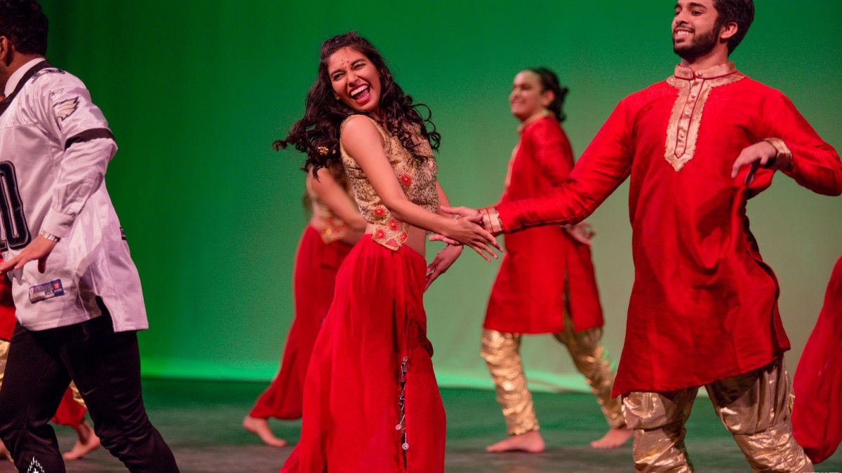 Maebelle Matthews, center, performs with Chalkaa, a Bollywood-Fusion dance team at Carolina.