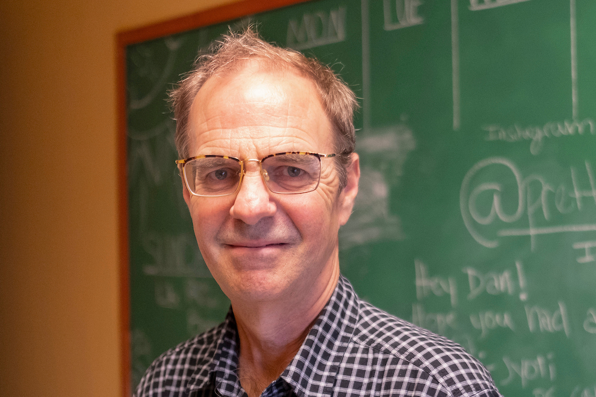 In his research, Anderson is experimenting with videos and screen composing to create a new form of scholarship about multimedia through multimedia. The closeup shot shows him in front of a traditional chalkboard.
