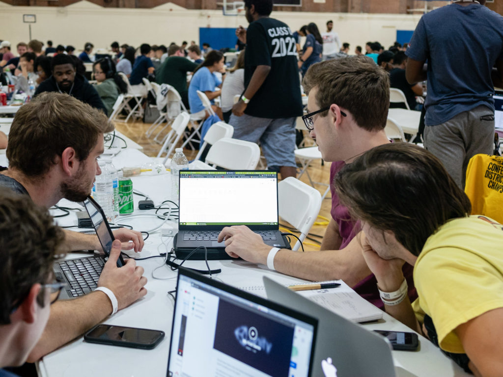 A team of students works to solve a problem at HackNC. (photo by Austin Wang)
