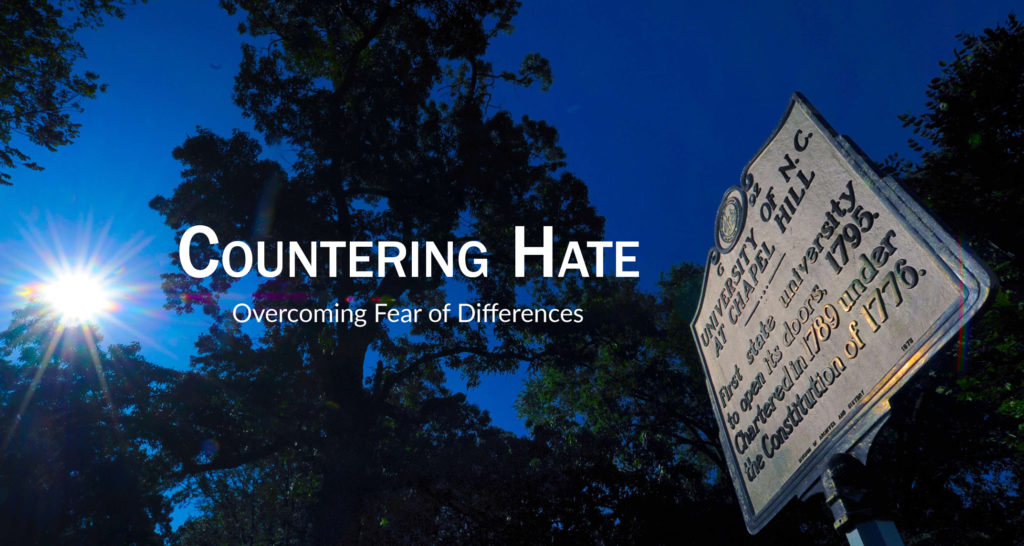 Countering Hate: Overcoming Fear of Differences graphic shows the night sky and the UNC-Chapel Hill historial sign