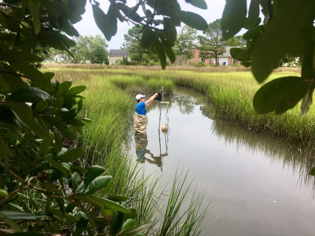 Adam Gold checks on a water monitoring station that he designed and built in the lab. A true Tar Heel, Gold is a Ph.D. student in the Ecology, Environment, and Energy Program, and previously earned his bachelor’s and master’s degrees from UNC. (Photo by Sarah Loftus)