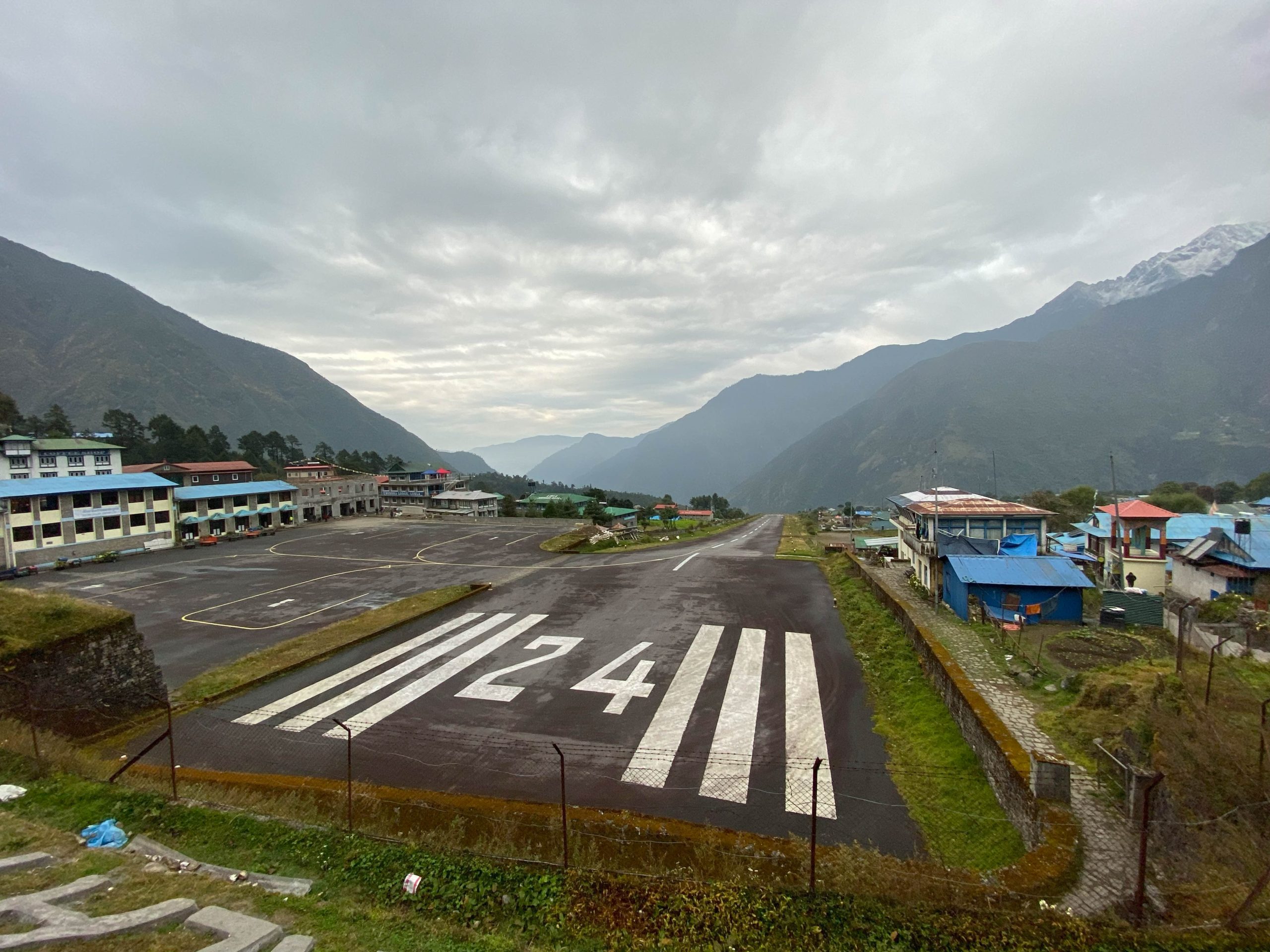 Looking down the Lukla airport runway, which slopes downward at 20 degrees and is the starting point for the trek. (photo by Roberto Camassa)