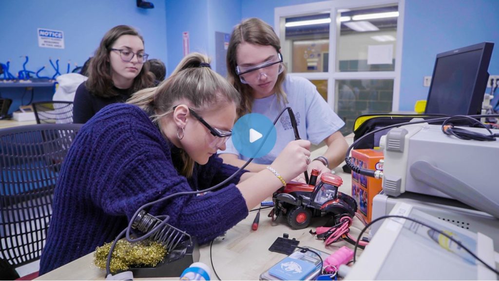 Screen capture from video of UNC students working on toys to adapt them for use for kids with disabilities.